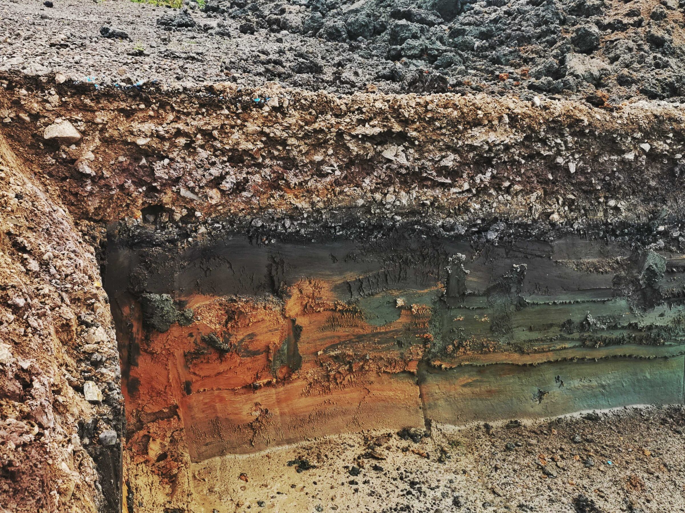 Layers of earth exposed in a cutting