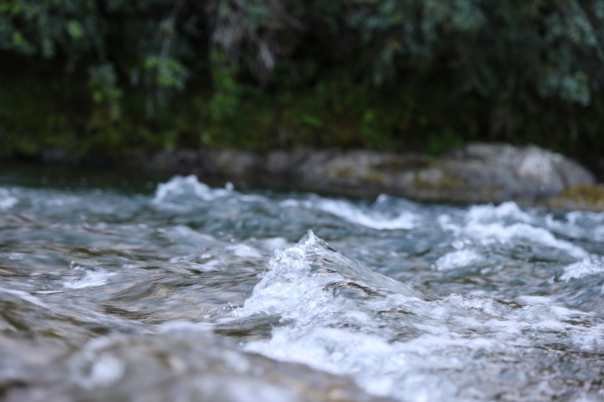 Water moving over river stones